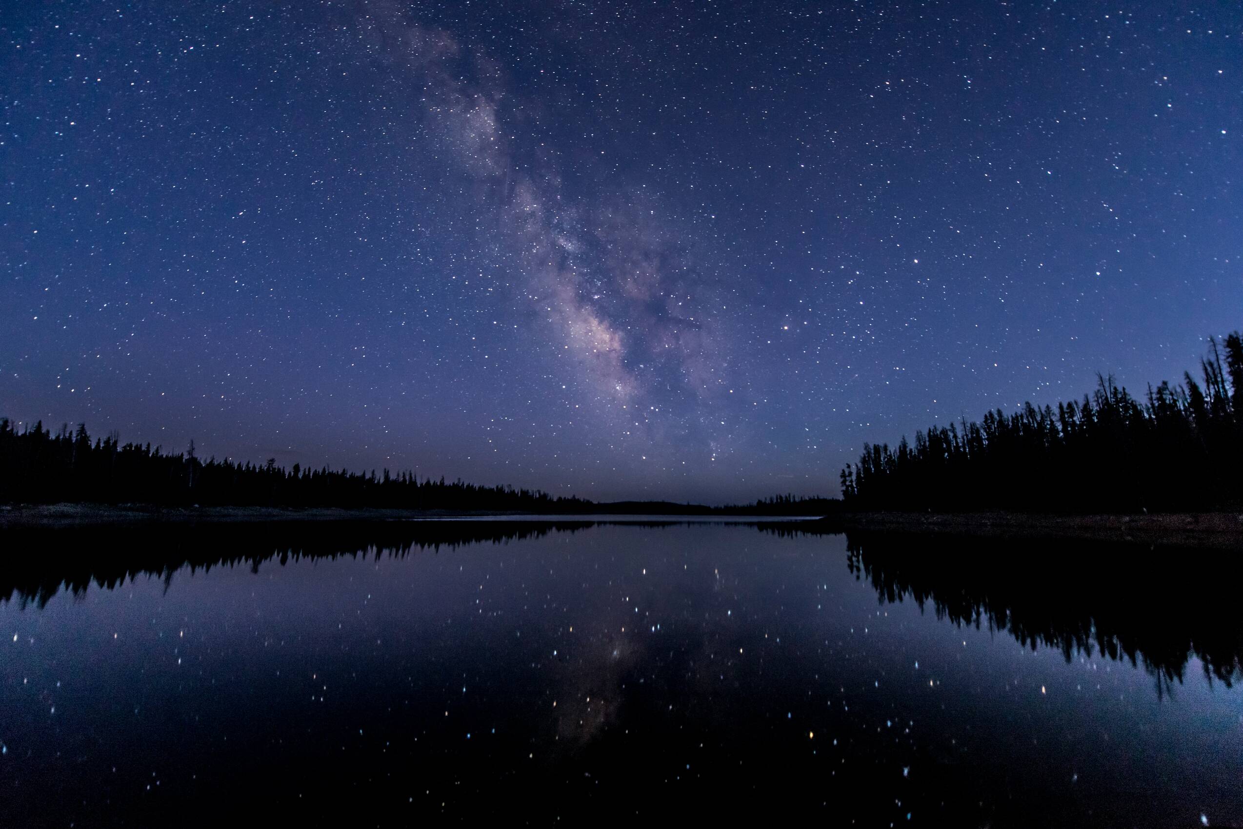 Spent the whole night in absolute silence at lost lake in the Uinta mountains watching the milky way roll across the horizon. This was taken just after the sun had gone down and the sky was still slightly blue.